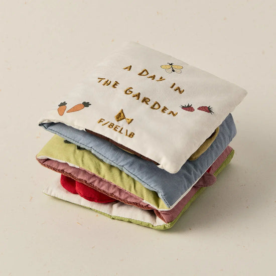 Fabric baby book garden theme on a beige background