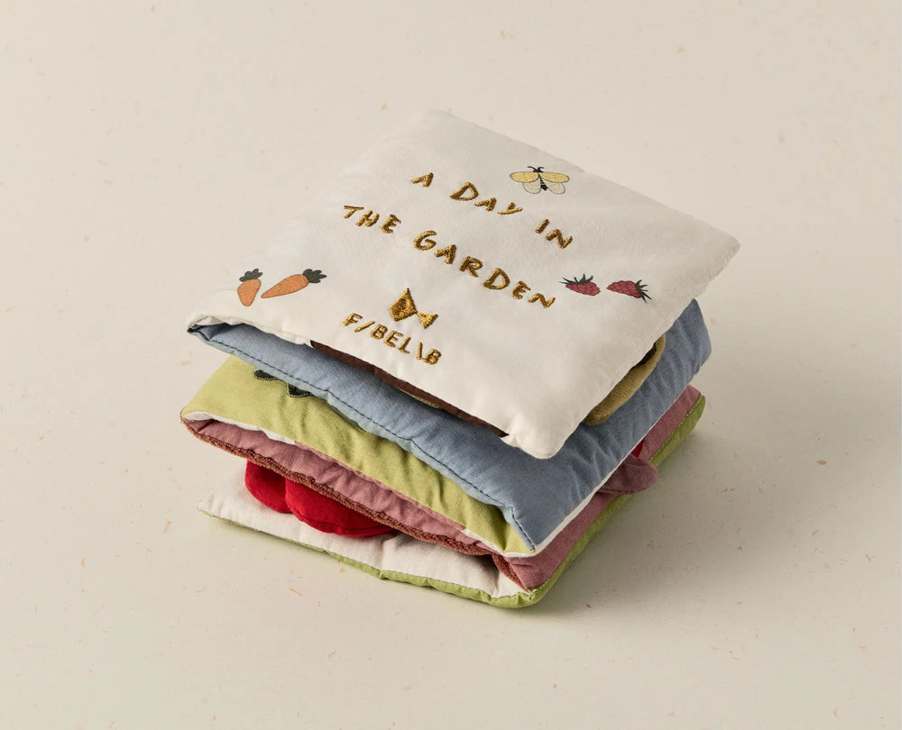 Fabric baby book garden theme on a beige background