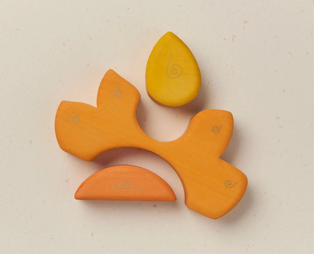 Yellow wooden stacker on a light beige background