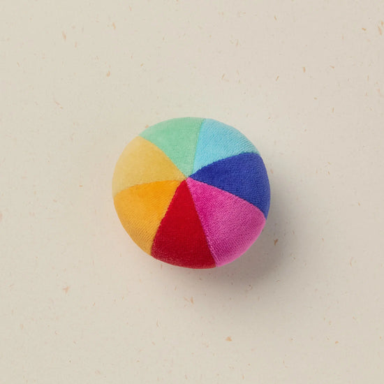 Multicolored ball on a beige background